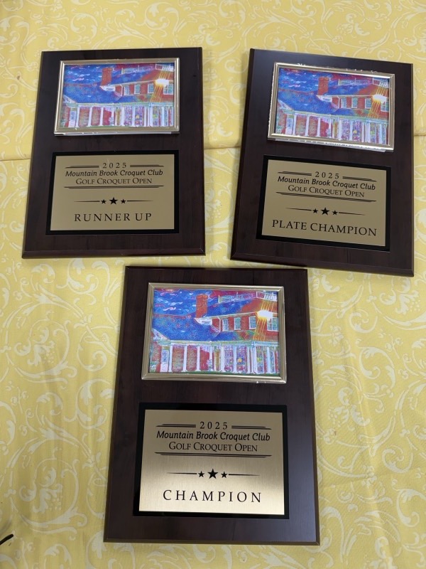 Champion, runner-up and plate champion plaques from the 2025 Mountain Brook Croquet Club Golf Croquet Open.